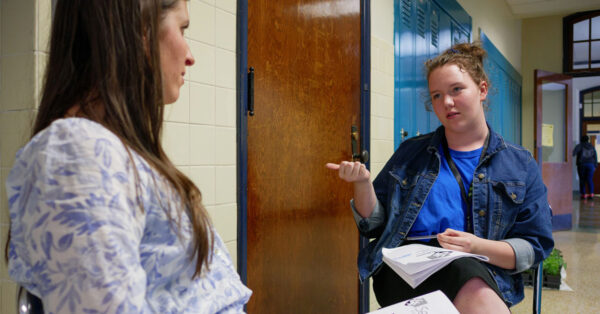 Student talking to coach