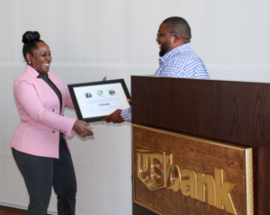 Nina Johnson accepting award for U.S. Bank