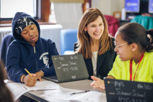Brenda Campbell mentoring two students during the Money Coach Program