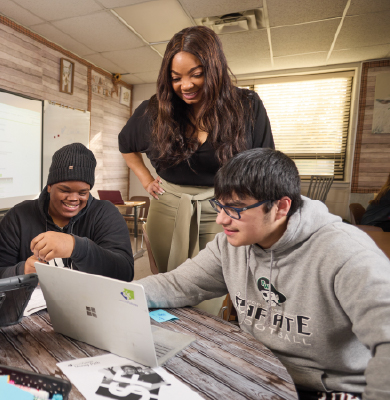 Volunteer with 2 students